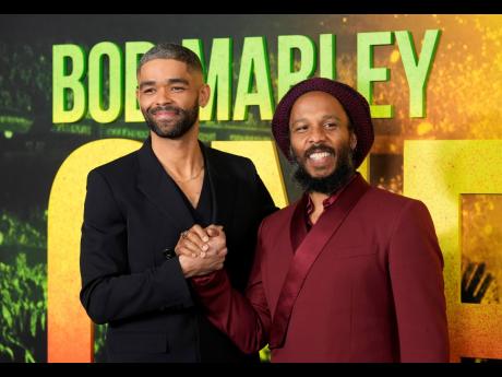 Kingsley Ben-Adir (left), star of ‘Bob Marley: One Love’, poses with Marley’s son Ziggy at the Los Angeles premiere of the film, Tuesday.