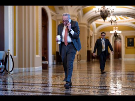 Senate Majority Leader Chuck Schumer arrives at the Capitol in Washington DC while Republicans hold a closed-door meeting after blocking a bipartisan border package that had been tied to wartime aid for Ukraine.