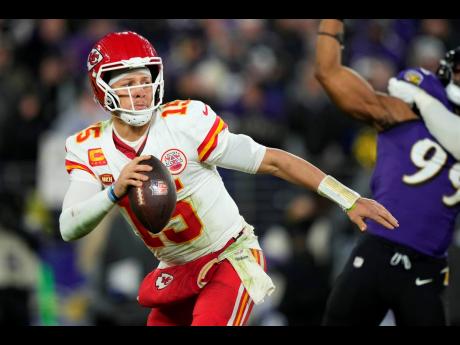 Kansas City Chiefs quarterback Patrick Mahomes (15) looks to pass during the second half of the AFC Championship NFL football game against the Baltimore Ravens on Sunday, January 28, 2024, in Baltimore. 