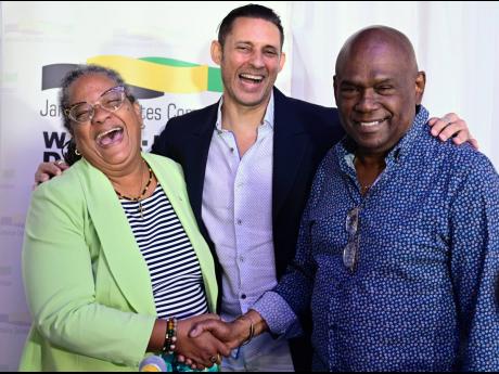 From left: Sharon Hay Webster of the Jamaica Labour Party; Brian Schmidt, vice president of the Jamaica Debates Commission; and Collin Campbell of the People’s National Party share a laugh during the launch of the 2024 local government election debates o