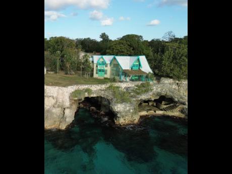  One of Jamaica’s most unusual homes, fearlessly built directly on top of two sea cave.