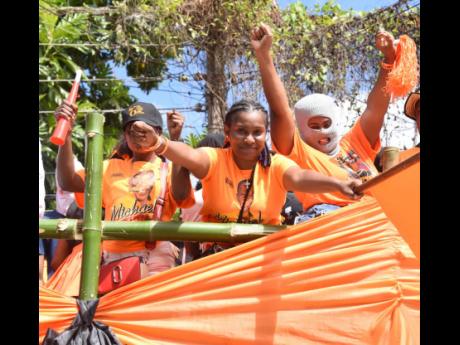 People’s National Party supporters in Montego Bay, St James, having a whale of a time last Thursday during nomination day activities for the local government polls.
