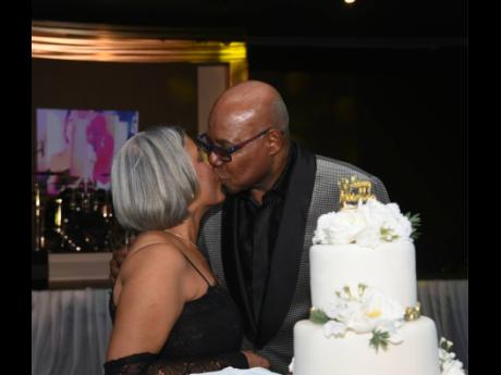 A kiss! Edmund Bartlett, minister of tourism and wife, Carmen, share a beautiful kiss at their 50th wedding anniversary celebration held at the Royalton Negril Resort Spa in Hanover.