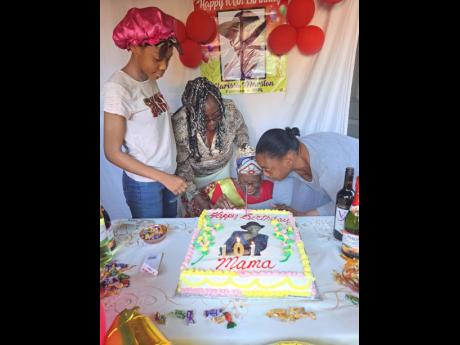 Clarissa Marston, celebrating her 101st birthday, is surrounded by caregiver Monique Barrett (right), daughter Dorothy Minott (second left) and great granddaughter Ashley Green. 
