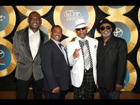 George Brown, from left, Ronald Bell, Dennis Thomas and Robert ‘Kool’ Bell, of Kool and the Gang, appear at the 2014 Soul Train Awards in Las Vegas’. Brown died November 16, 2023 in Los Angeles, after a battle with cancer. Ronald Bell died in 2020 an