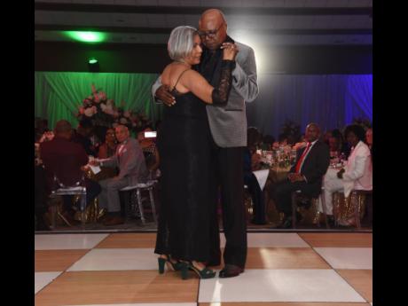 The lovely couple, Edmund (right) and Carmen Bartlett, share a special moment on the dancefloor.