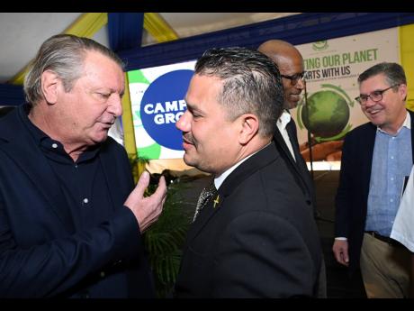 Jean-Philippe Beyer (left), Managing Director of J. Wray and Nephew (JWN) Limited speaking with Matthew Samuda, minister of water, environment, climate chandge and the blue and green economies, during the official launch and ommissioning of column stills a