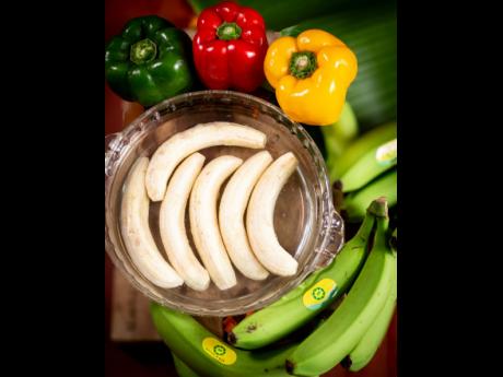 The trick to keep your green bananas from changing colour is to tip a teaspoon of vinegar or lime juice into your boiling water.