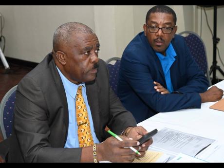 Raymond Anderson (left) and Dave Cameron, members of the Real Solid Action slate running in the next Jamaica Football Federation election. 