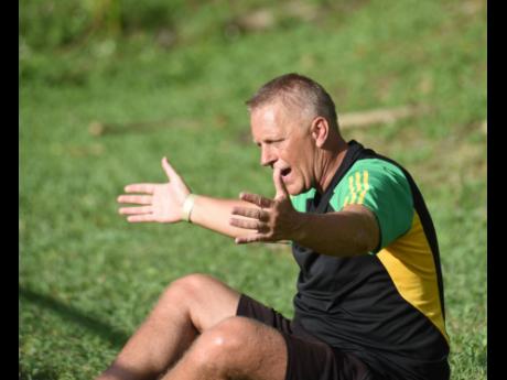 Reggae Boyz coach Heimir Hallgrimsson addresses players during a practice game against Montego Bay United at Wespow Park in Montego Bay yesterday.