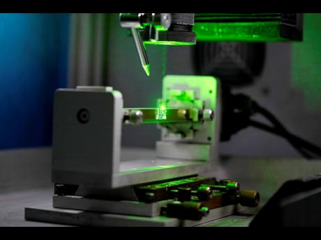 A laser cuts a lab-grown diamond at Greenlab Diamonds in Surat, India.