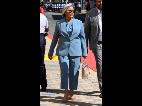 Carmen Bartlett, wife of Minister of Tourism Edmund Bartlett, stuns in a blue suit and her sleek silver tresses styled in a bob. 