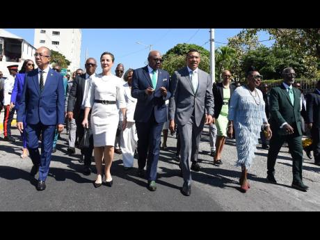 Prime Minister Andrew Holness (centre) leads government members on a walk towards Gordon House for the ceremonial opening of Parliament on Thursday. At front are (from left) Dr Horace Chang, minister of national security; Kamina Johnson-Smith, minister of 