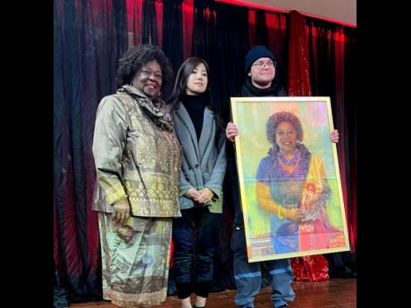 Dr. Jean Augustine, artist Connie Lee and her partner. Lee presented her with this portrait.