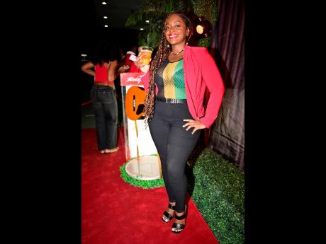 Blurring the lines between reggae and dancehall with her outfit, Red Stripe’s Sherry Perrier posed with her favourite drink.