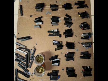 Some of the weapons found in the operation at the Kingston Wharves on Friday.
