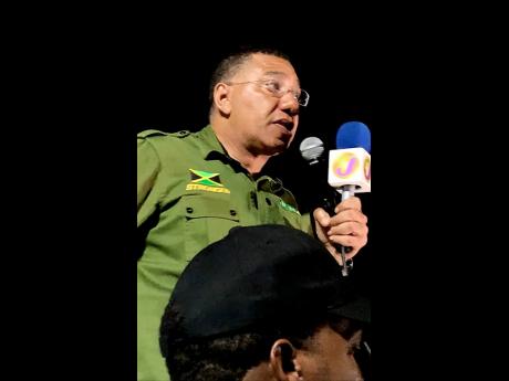 Prime Minister Andrew Holness addressing a gathering in Alligator Pond, Manchester, on Friday. 