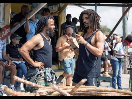 This image released by Paramount Pictures shows producer Ziggy Marley (left) and Kingsley Ben-Adir on the set of 'Bob Marley: One Love'.