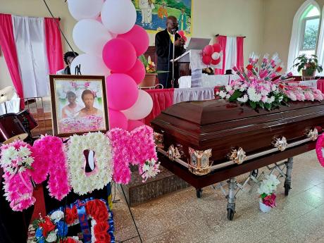 The body of Enid Francis lies inside the Wheeler’s  Mount Baptist  Church, where mourners gathered for her funeral on February 19.