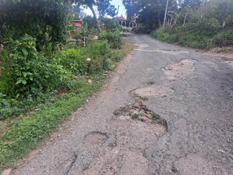 A section of the main road between Freeman’s Hall and Albert Town in Trelawny. Residents of Freeman’s Hall say the poor state of the roadway has not been adequately addressed for 50 years.