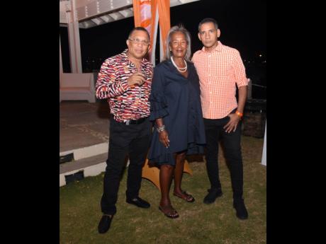 Janet Madden, director at Madden’s Funeral Home is sandwiched between businessman and owner Donat Grant (left) and attorney-at-law Charles Ganga-Singh at the Valley Foundation fundraising event hosted by Dr Andre Haughton, Opposition spokesman on commerc