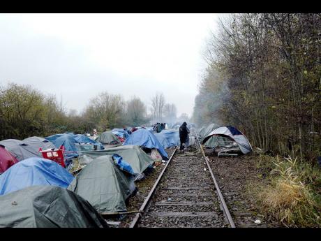 A migrants makeshift camp is set up in Calais, northern France, where migrants wait for the change to make a dash across the English Channel. Britain and its former partners in the European Union have struck a deal to cooperate more on tackling illegal mig