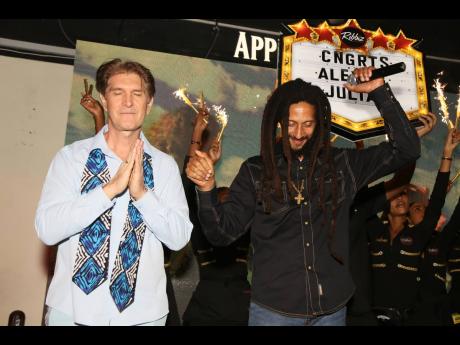 Alex Antaeus (left) and Julian Marley are congratulated as they appear on stage at Ribbiz.