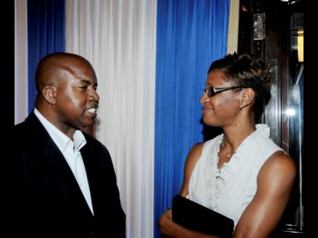 Hubert Lawrence (left) in conversation with Jamaica’s first female Olympic gold medallist, Deon Hemmings.