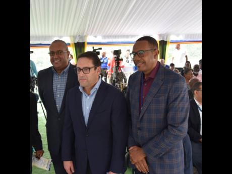 American Airlines executives Wellesley Joseph (left), senior regional manager, Western Caribbean; and Jose Maria Giraldi (centre), managing director, Mexico, Central America and the Caribbean, share lens with senior director in Jamaica’s Ministry of Tour