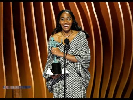 Ayo Edebiri accepts the award for outstanding performance by a female actor in a comedy series for ‘The Bear’ during the 30th annual Screen Actors Guild Awards. 