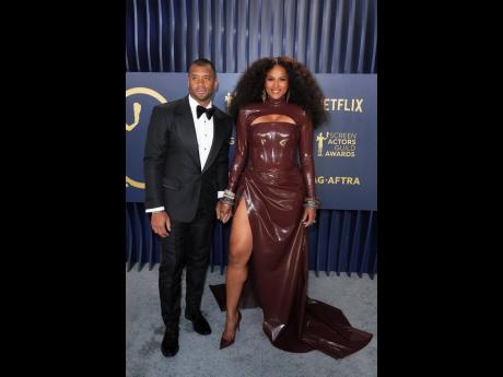 Russell Wilson (left), poses with wife, Ciara, in Venus Prototypex.