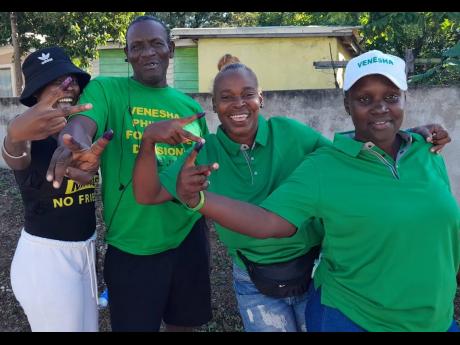 Some supporters of the Jamaica Labour Party’s Venesha Phillips in August Town, St Andrew, on Monday.