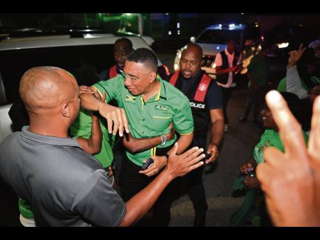 Jamaica Labour Party Leader Andrew Holness on arrival at the party’s Belmont Road, New Kingston headquarters last night. 