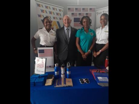 The United States Embassy, represented by Public Affairs Officer Mike Lavallee and Public Engagement Assistant Kimberly-Joe Osborne, was there to promote its Youth Ambassadors programme. They are sandwiched by Caribbean Maritime University students, Titany