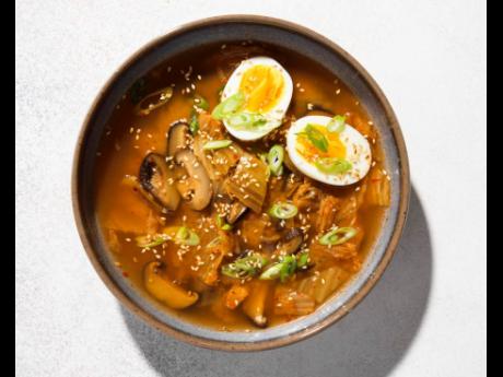 This image released by Milk Street shows a miso, shiitake mushroom and kimchi soup.