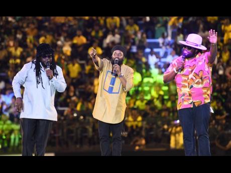 Peetah Morgan (centre) performing with his brothers Mr Mojo Morgan (left) and Gramps Morgan after the reggae group accepted the Jamaica Reggae Icon Award at the Jamaica 61 Grand Gala held at the National Stadium, St Andrew, last August.