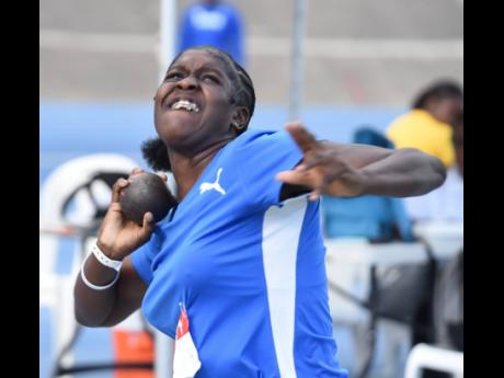 Jamelia Young of Clarendon College in action during the under-17 girls’ shot put on yesterday’s opening day of the three-day Carifta Trials at the National Stadium.