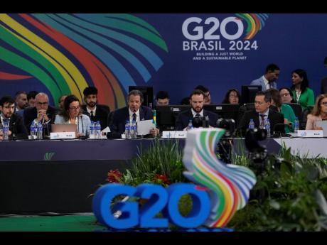 Brazilian Finance Minister Fernando Haddad, centre, speaks during the G20 Finance Ministers and Central Bank Governors meeting in Sao Paulo, Brazil, Thursday, February 29, 2024.