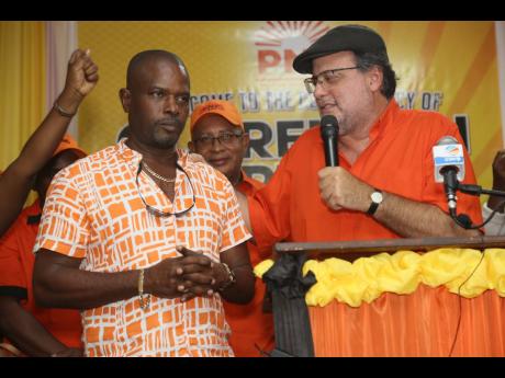 
In this 2022 file photo, PNP president Mark Golding (right) welcomes Dennis Meadows to the party.