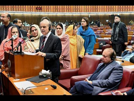 In this photo released by the National Assembly office, Pakistan’s newly elected Prime Minister Shehbaz Sharif (fourth left) delivers his speech following his appointment, at a parliament session, in Islamabad.