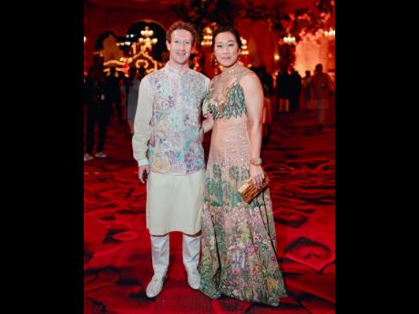 This photograph released by the Reliance group shows Mark Zuckerberg and wife Priscilla Chan posing for a photograph at a pre-wedding bash of Mukesh Ambani’s son Anant Ambani.