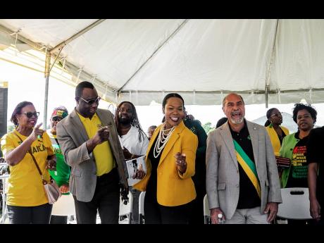 Dr Kasan Troupe, permanent secretary in the Ministry of Education and Youth, along with other dignitaries, immerse themselves in the festivities of Jamaica Day at William Knibb Memorial High School in Trelawny on February 23. 