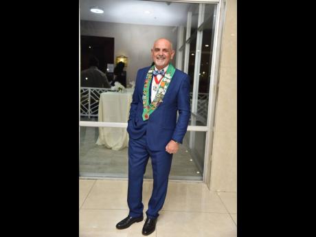 Pierre Battaglia, bailli, Chaîne Jamaica, Chaîne des Rôtisseurs, added a dash of playfulness to his chequered navy suit with a gingham bow-tie. 