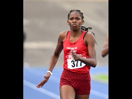 Shanoya Douglas of Muschett High wins the under-20 girls’ 200 metres in 22.85 seconds on yesterday’s final day of the Carifta Trials at the National Stadium.