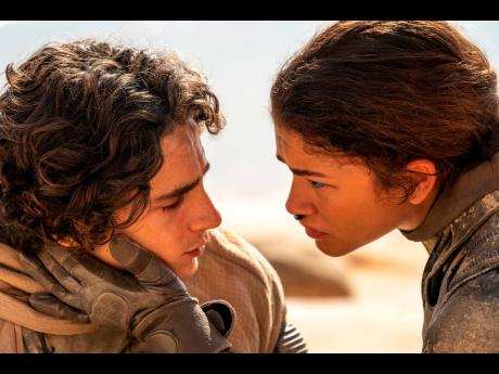 This image released by Warner Bros. Pictures shows Timothee Chalamet, left, and Zendaya in a scene from ‘Dune: Part Two’.