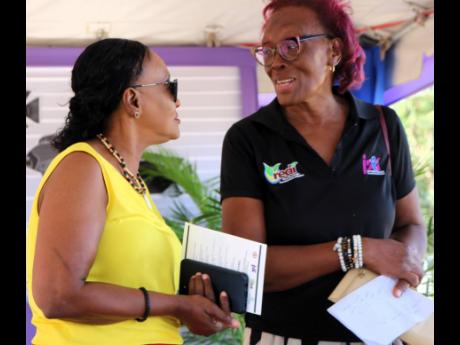 Member of Parliament for St Catherine Eastern Denise Daley (left) engages in conversation with Programme Officer for the Jamaica Social Investment Fund Dawn Allison before the start of the groundbreaking ceremony for the Upgraded Tilapia Hatchery last Thur