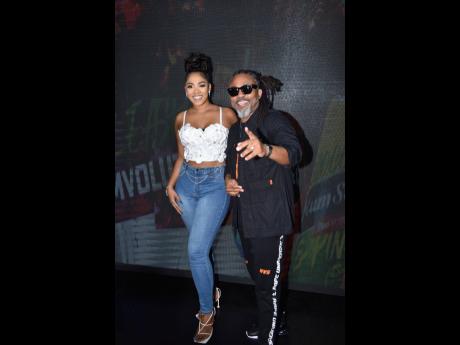 Chiney K (left), smiles wide as she shares the lens with soca artiste Machel Montano, who kept it cool in a streetwear-inspired outfit.