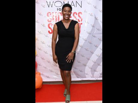 Nicole Richards from Kurly Kulture Ltd exudes charm and simplicity, rocking a black dress.
