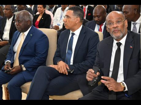 Prime Minister Andrew Holness (centre) with Ariel Henry (right), prime minister of Haiti, and Philip Davis, prime minister of The Bahamas, at the opening ceremony for the Haiti Security Talks at the Ministry of Foreign Affairs and Trade in Jamaica in June 