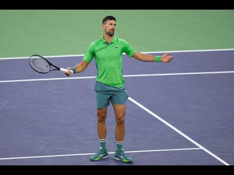 Novak Djokovic, of Serbia, reacts after losing a point against Luca Nardi, of Italy, at the BNP Paribas Open tennis tournament on Monday.